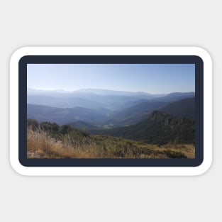 A view of mountains and valley, blue sky and green earth - north Spain road trip. Sticker